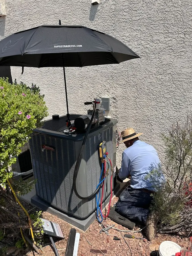 HVAC technician performing outdoor AC maintenance in Bridgewater Town